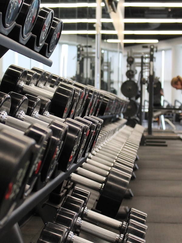 Personal trainer coaching a client through a private strength session at Pump Fitness in Monroe, NJ